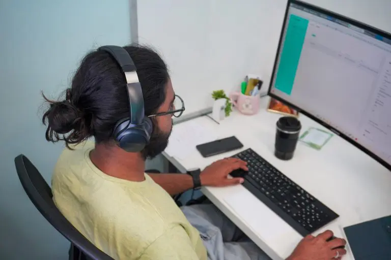 Person working on website design and SEO optimisation on a desktop computer
