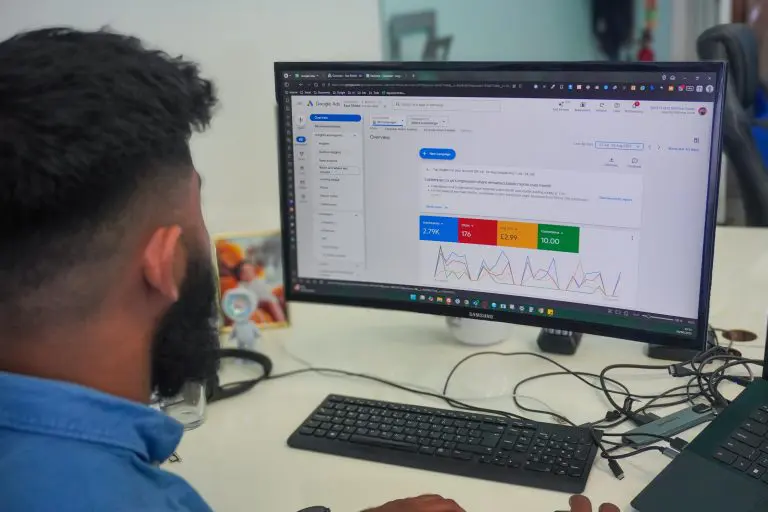 Digital marketer reviewing Google Ads performance and budget data on a desktop screen