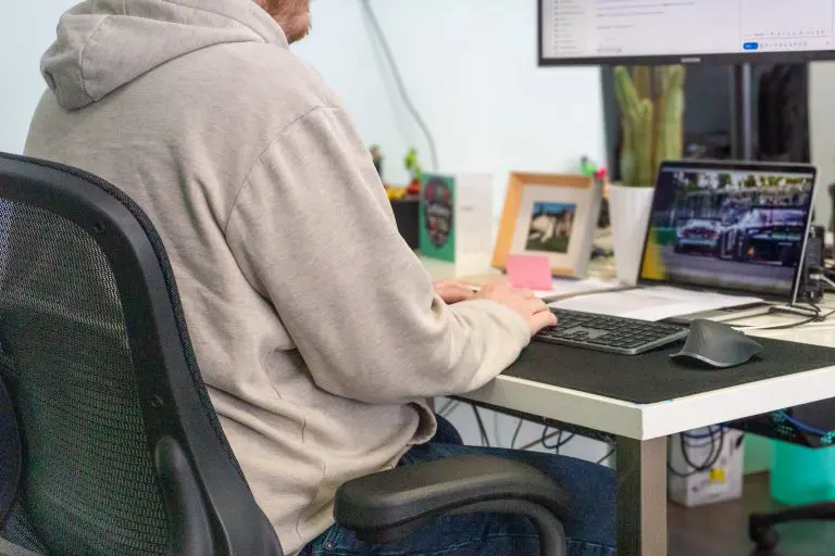 Web designer working at desk on website project in office